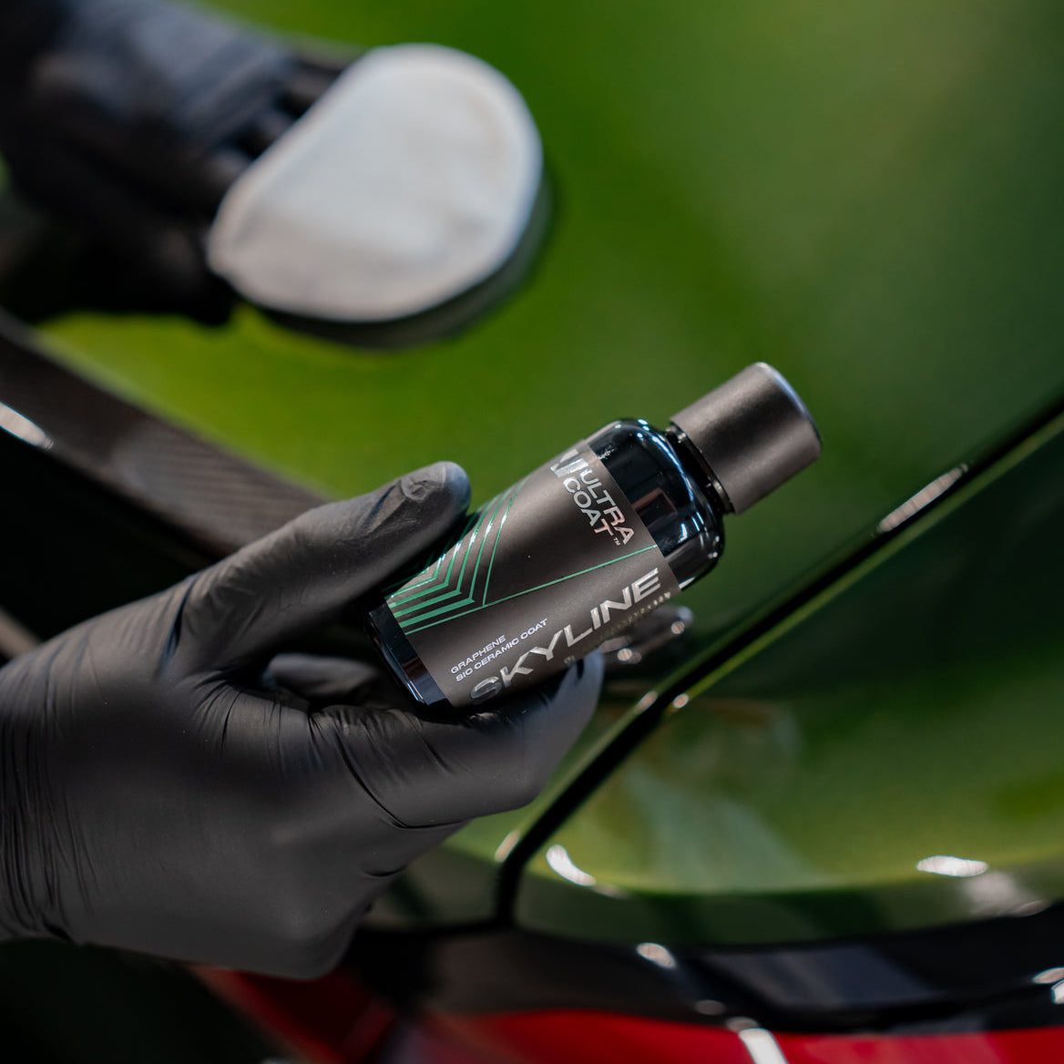 ULTRACOAT Skyline bottle during coating application on automotive paint