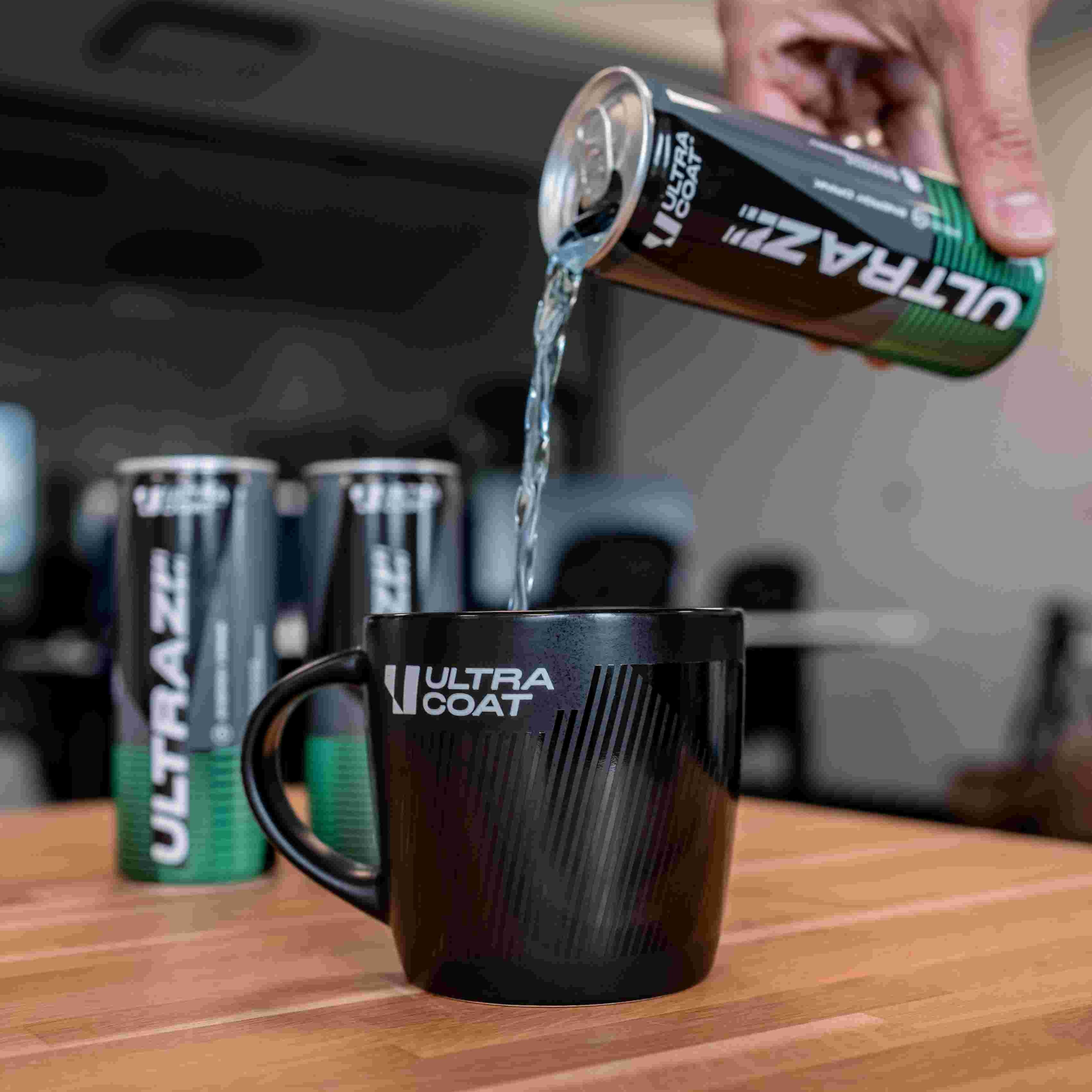 Black ULTRACOAT mug while pouring an ULTRAZZZ drink
