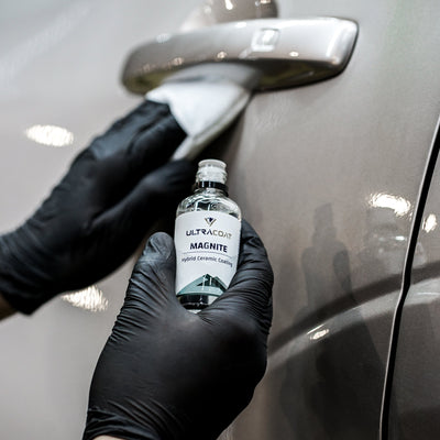 ULTRACOAT Magnite bottle with an applicator on automotive paint