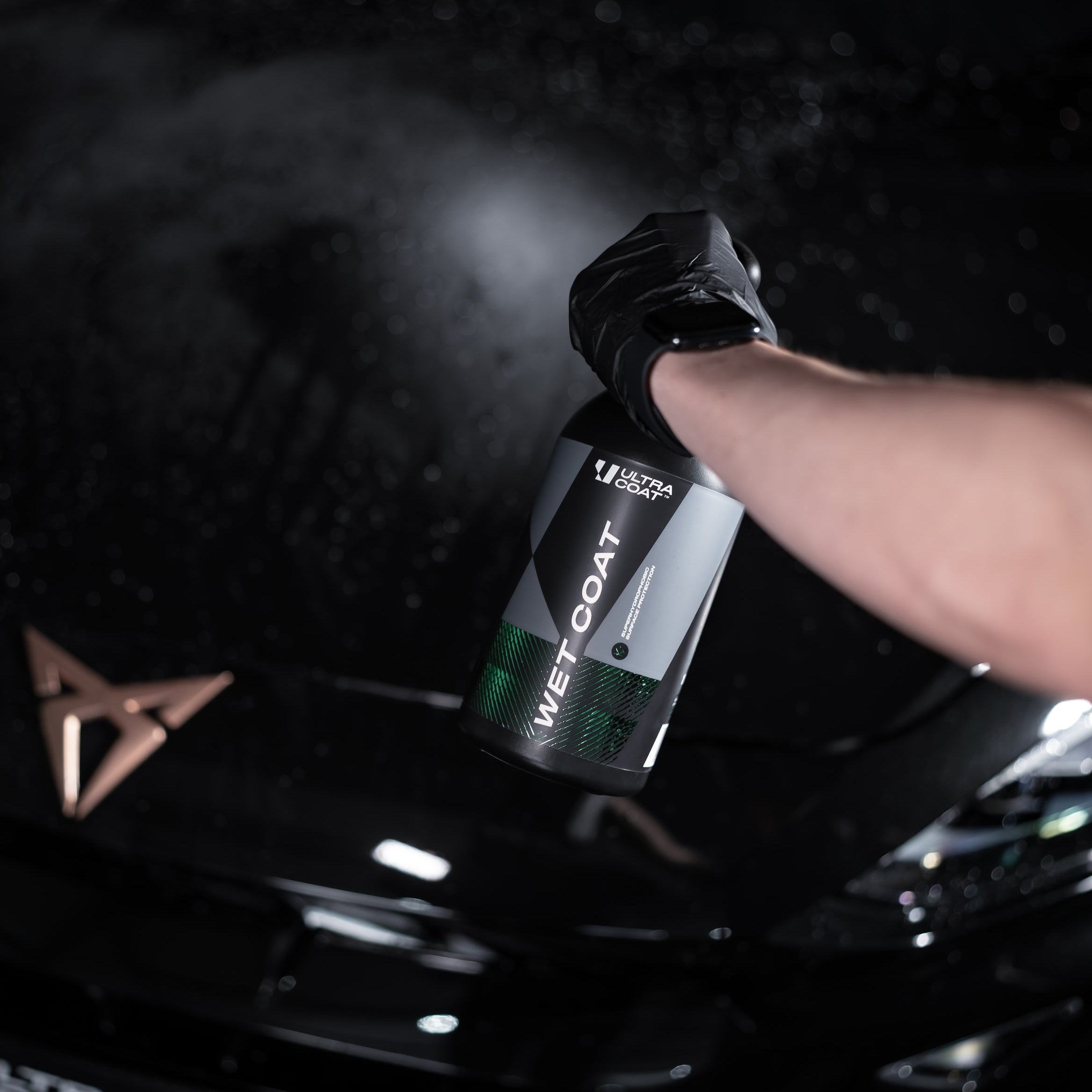 ULTRACOAT Wet Coat bottle during application on wet automotive paint